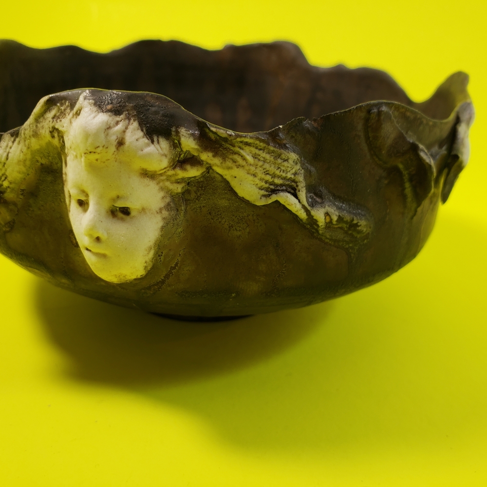 Artistic Bowl with Many Faces